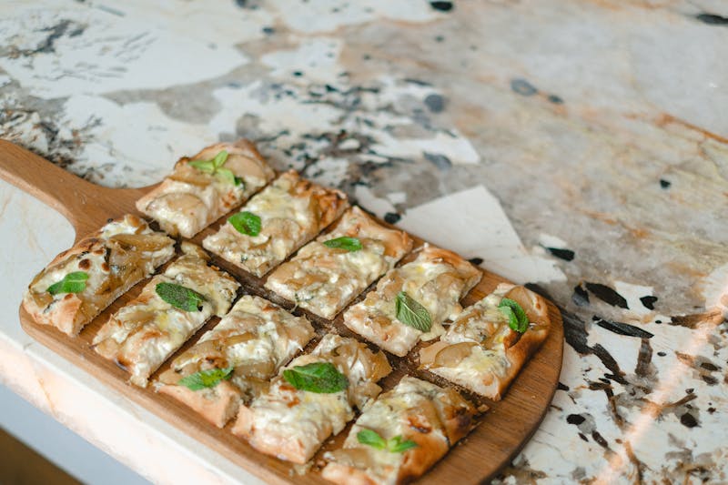 Four Cheese pizza with rich blend of mozzarella, gorgonzola, parmesan, and ricotta